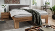 Tête de lit revêtue de cuir anthracite avec passepoil décoratif